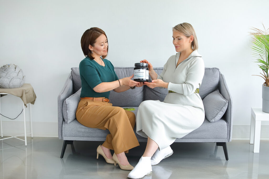 A naturopathic doctor consulting a patient about lab testing and diagnostic services at VeraVita Clinic in Calgary.