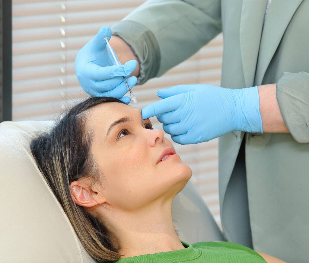 Patient receiving cosmetic treatment session to rejuvenate and enhance facial appearance at VeraVita Clinic in Calgary.